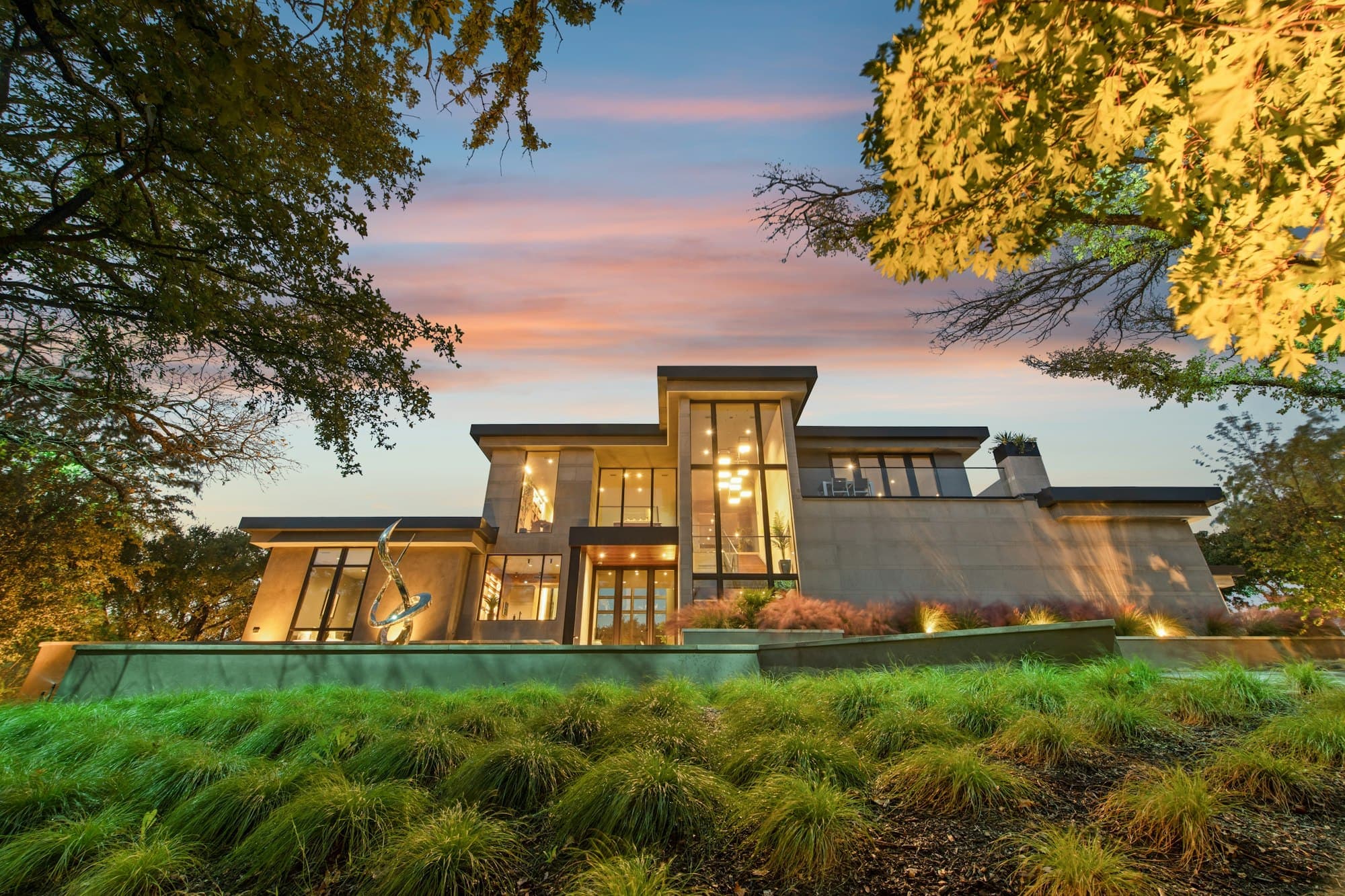 A contemporary residence glowing at dusk